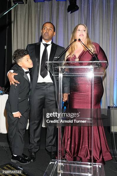 Collins Eromo, Dr. Ersno Eromo, and Heather Richmond speak onstage at the 2024 Illuminate Life Gala